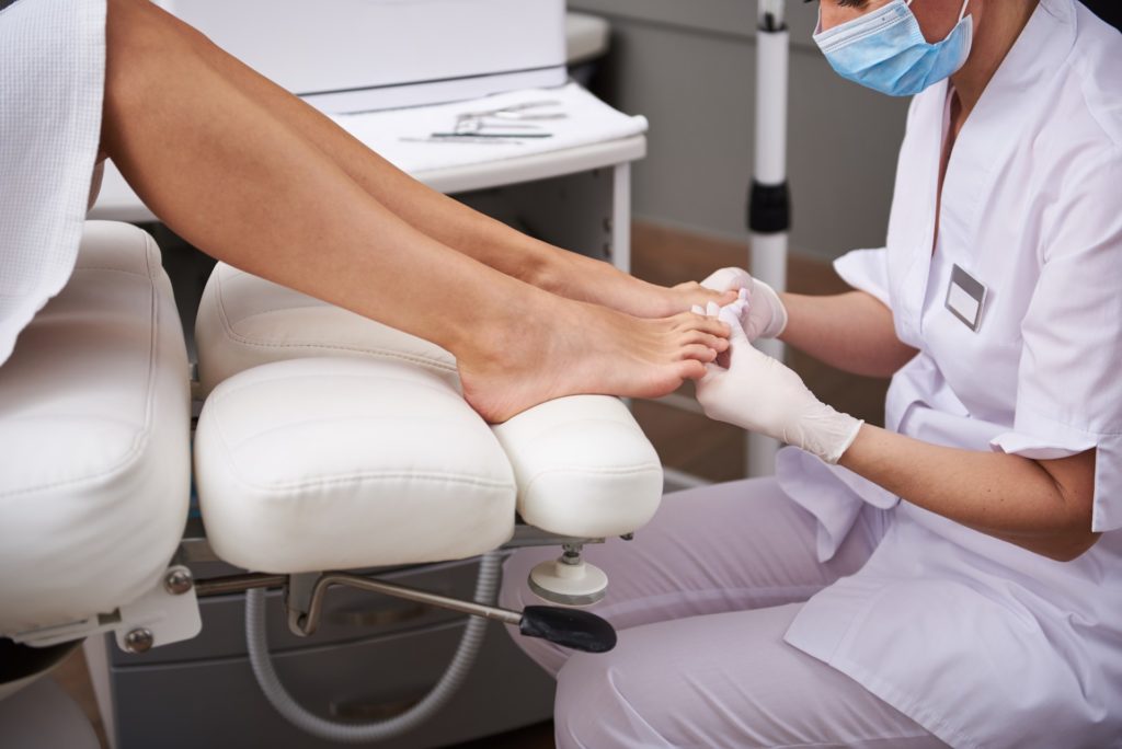 doctor checking a patients toes