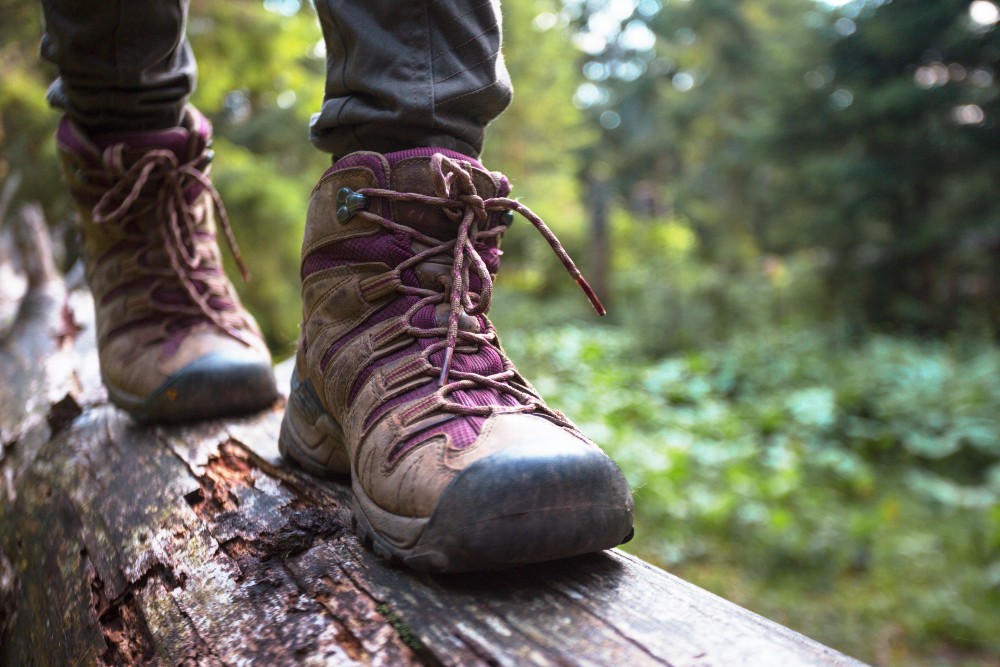 Hiking boots on a fallen log